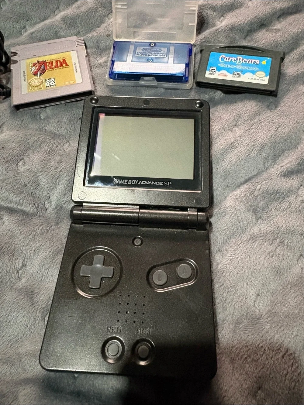 Nintendo Game Boy Advance SP Black with Pokémon sapphire, Zelda, Care Bears